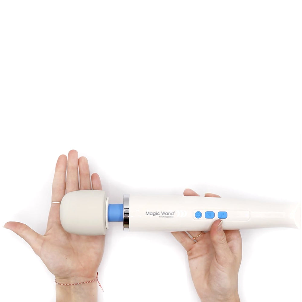Magic Wand Plus vibrating wand sex toy being held by two hands on a plain white background. Available at SugarX in the Vibrating Wand section of the Sex Toy collection.