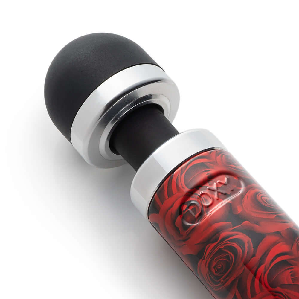 Close up of Doxy Die Cast wand vibrator’s silicone head in rose’s design. Available at SugarX in Wand Vibrators in the Sex Toys collection.