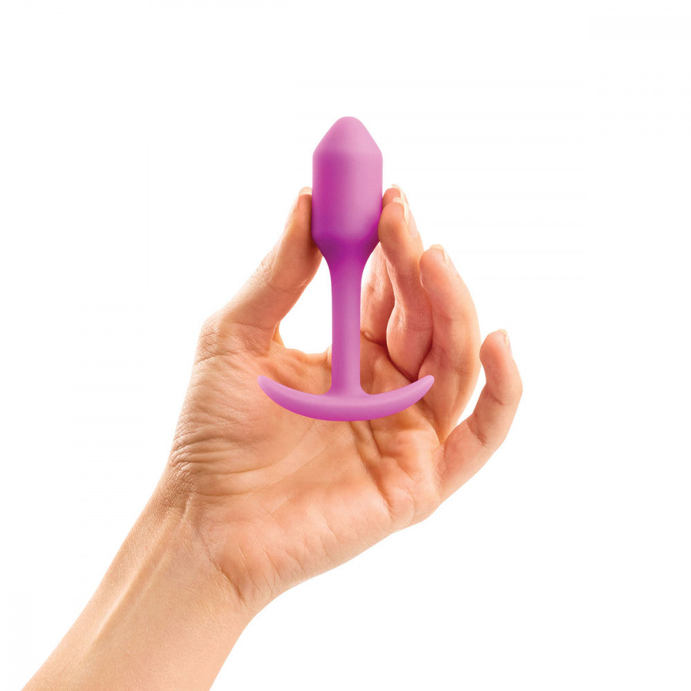 B-Vibe Snug Plug 1 - Fuchsia on white background. Available at SugarX in Sex Toys in the Butt Plug collection.
