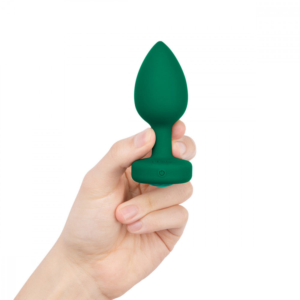 B-Vibe Vibrating Jewel Plug Medium/Large - Emerald on white background. Available at SugarX in Sex Toys in the Butt Plug collection.