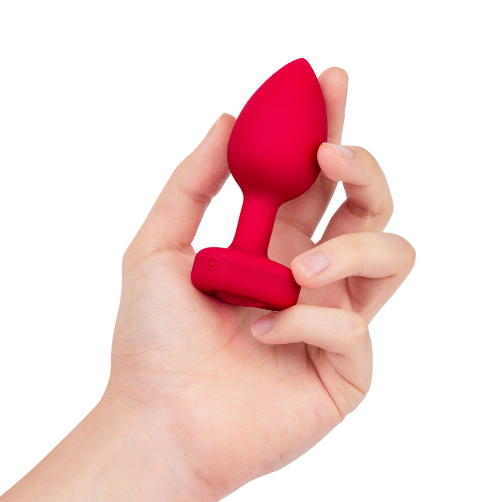 B-Vibe Vibrating Heart Plug Medium/Large - Scarlet Ruby on white background. Available at SugarX in Sex Toys in the Butt Plug collection.