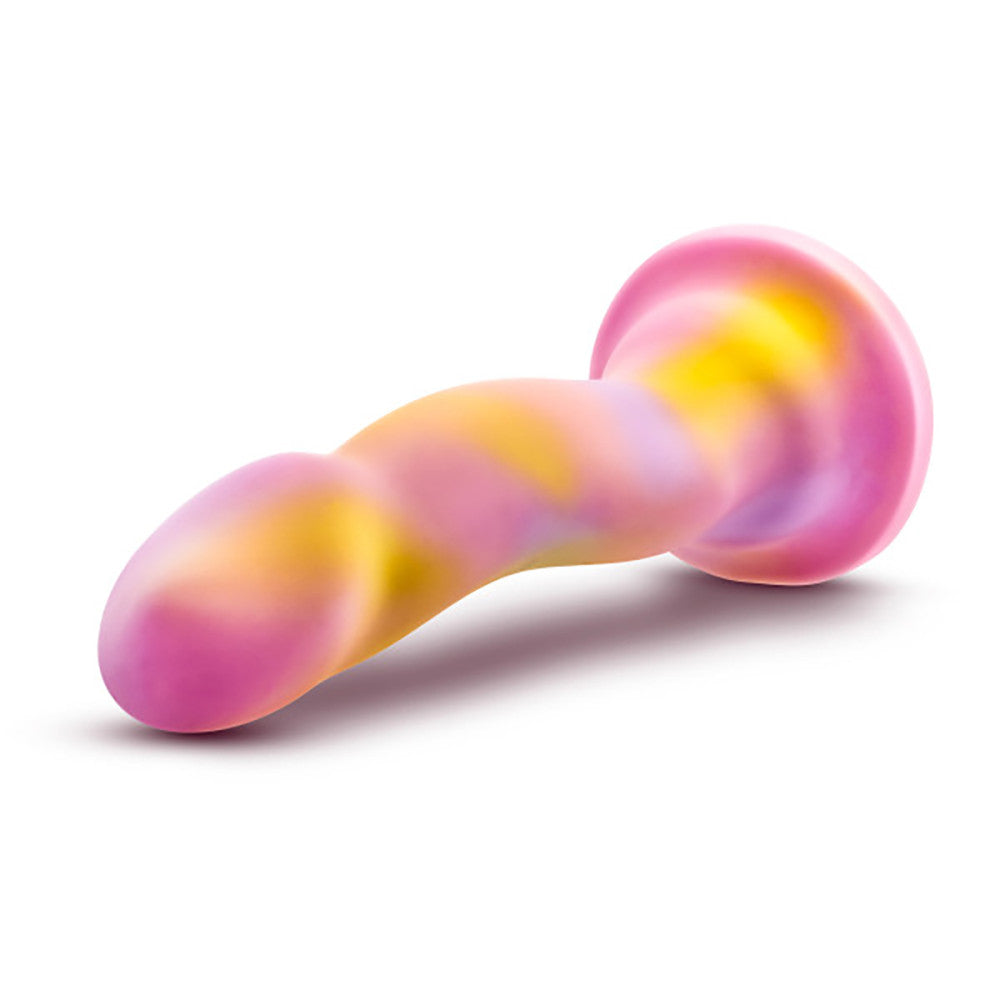 Side view of Blush Avant Sun’s Out pink silicone dildo with curved shaft and suction cup at SugarX.