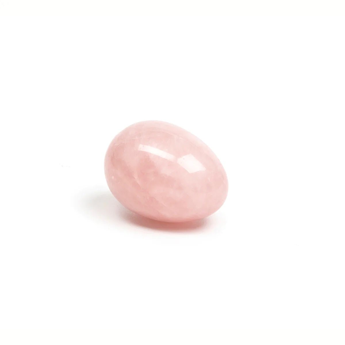 Rose quartz yoni egg by Chakrubs on neutral background at SugarX.