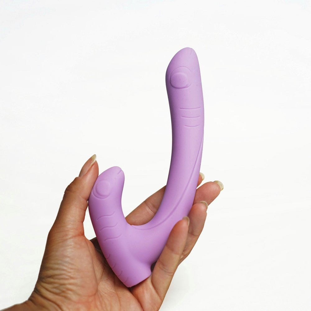 Hand holding the periwinkle Jix vibrator, showing its soft, flexible design ideal for all bodies.