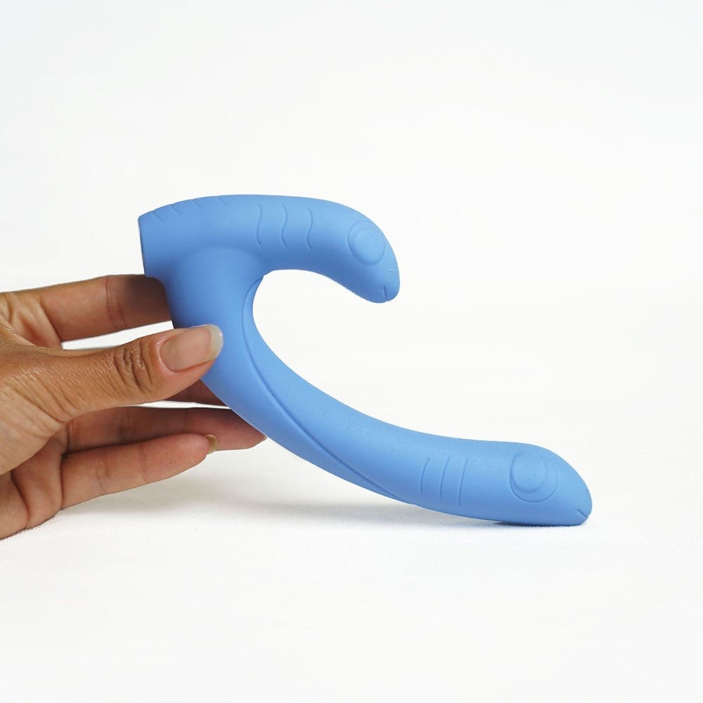 Jix vibrator by Cute Little Fuckers shown up close, held in hand against a white background.