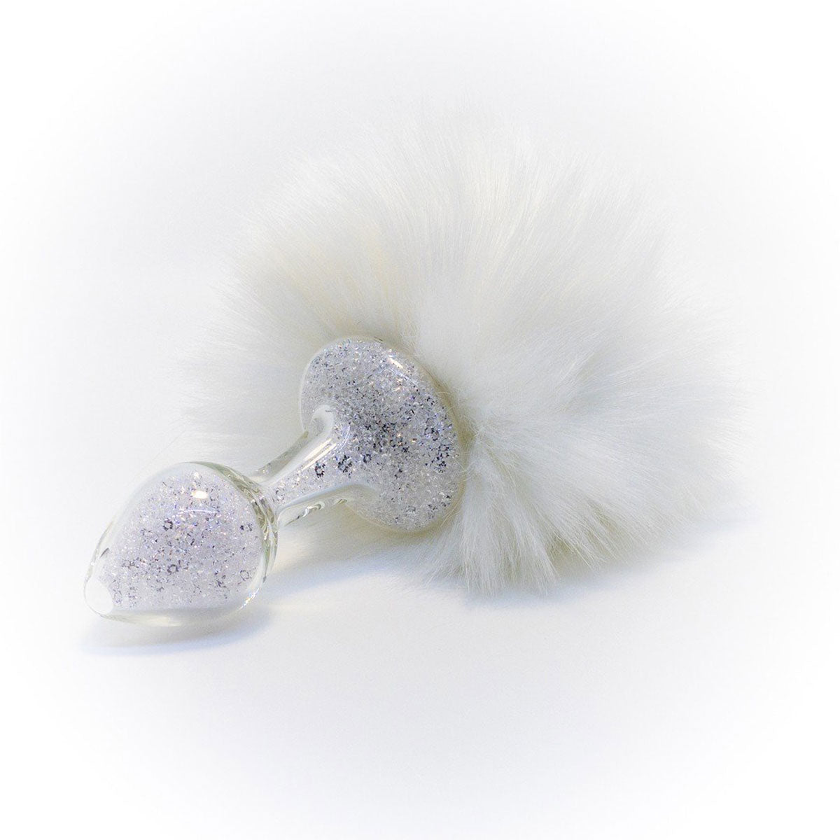 Crystal Delights Magnetic Sparkle Bunny Tail crystal filled Butt Plug in White on a plain white background showcasing its design. Available at SugarX in the Butt Plug section of the Sex Toys collection.