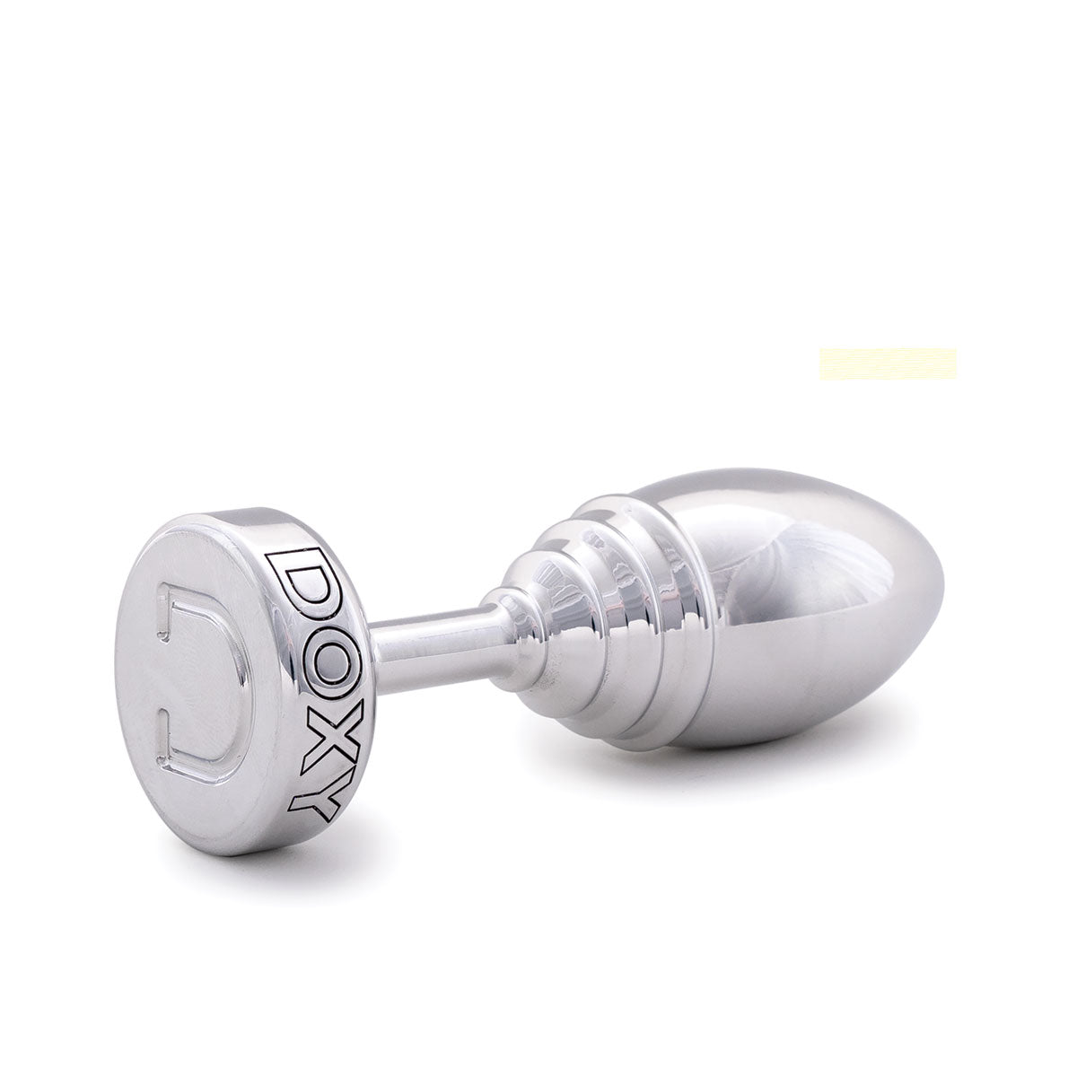 Doxy Ribbed Metal Butt Plug’s lying on its side on a plain white background showcasing its tapered aluminum body and extra long stem. Available at SugarX in the Butt Plug section of the Sex Toys collection.