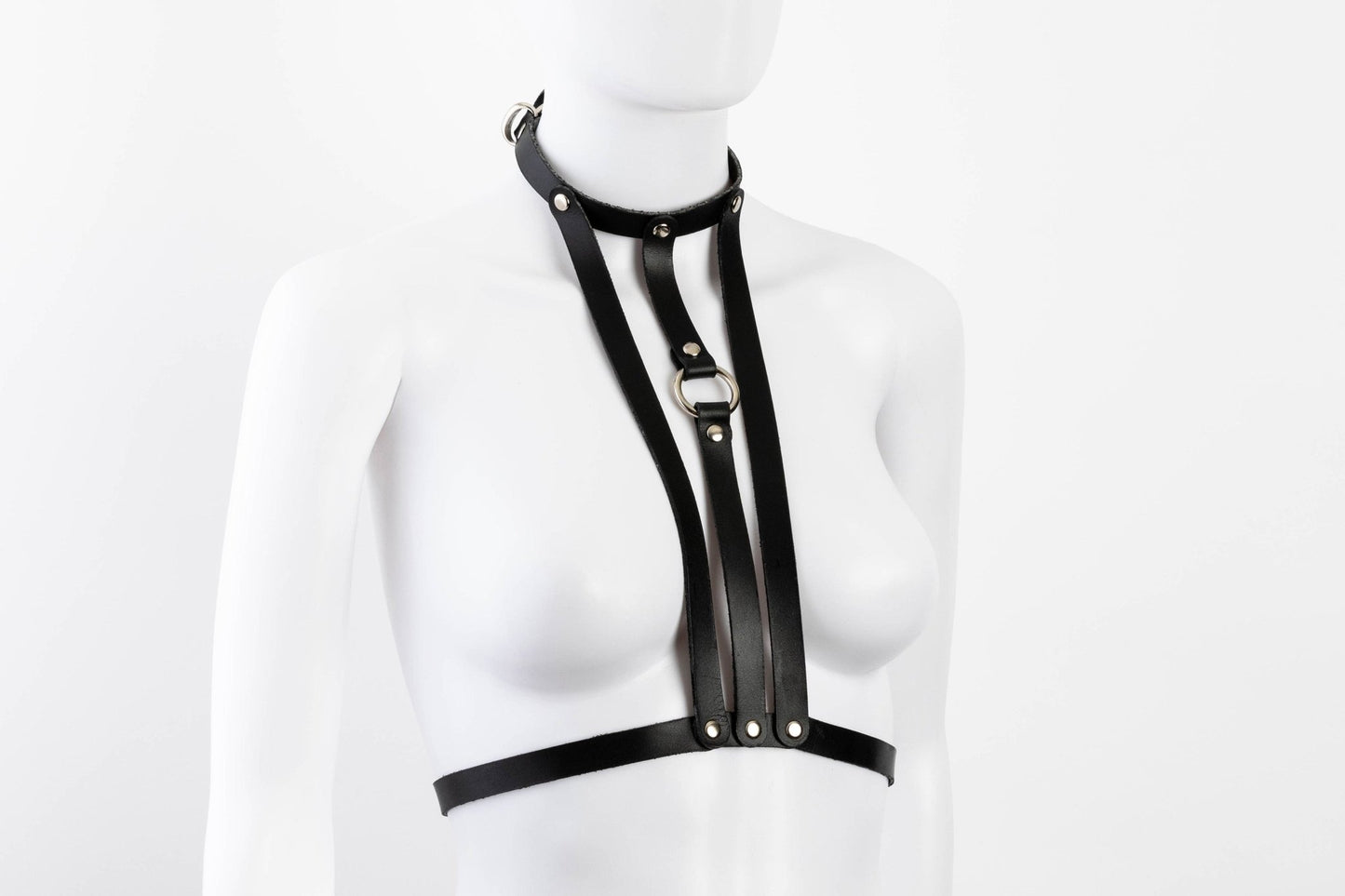 Liberator Lano Leather Chest Harness with adjustable straps, nickel-plated accents, and center O-ring for BDSM restraint and bondage play. Shop now at SugarX! Black harness.