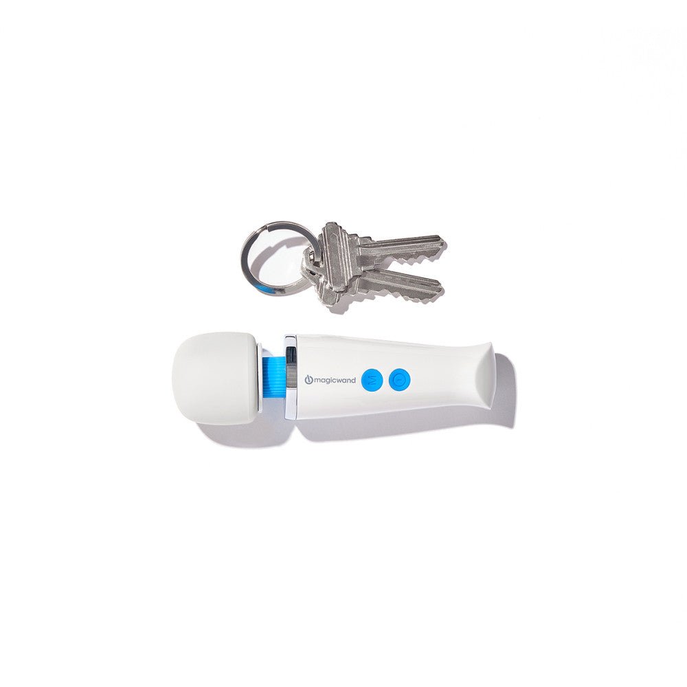 Magic Wand Vibrator Micro Rechargeable vibrating wand sex toy lying next to keys for comparison on a plain white background. Available at SugarX in the Wand Vibrator section of the Sex Toy collection.