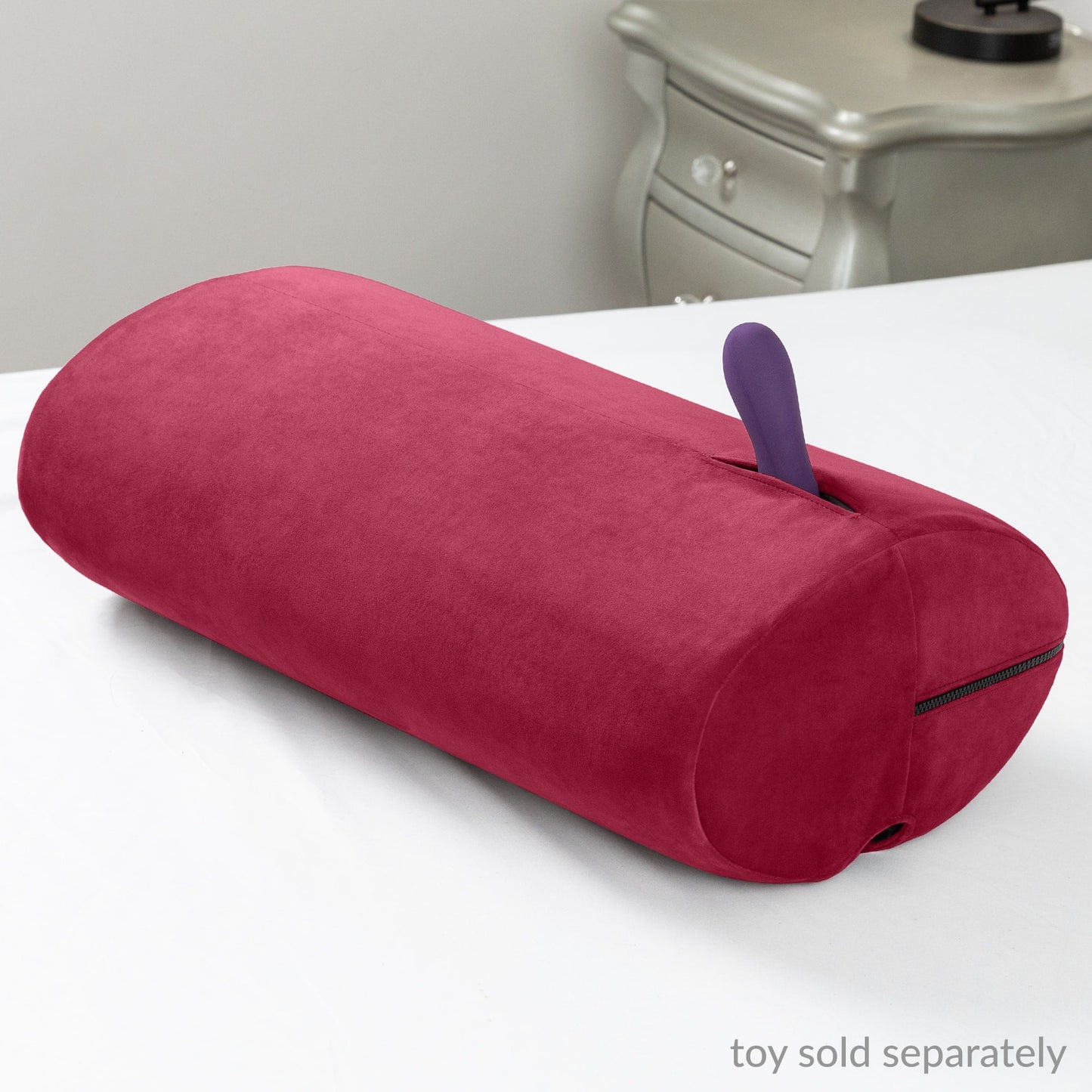 The luxurious Merlot Liberator Wing sex toy mount on a bed, designed for hands-free pleasure and comfort, available at SugarX.