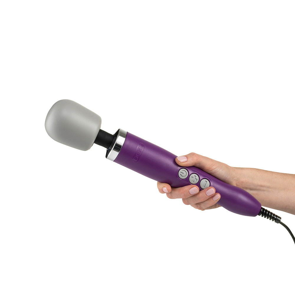 Doxy Original Massager Wand Vibrator in Purple being held by a hand on a white background. Available at SugarX in Vibrators in the Sex Toy Collection.