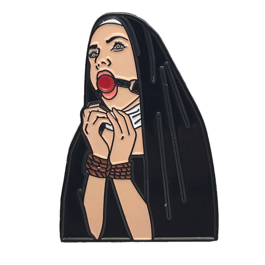 Geeky & Kinky Nunsense Enamel Pin displayed showcasing its design. Available at SugarX in Jewelry in the Pins collection.