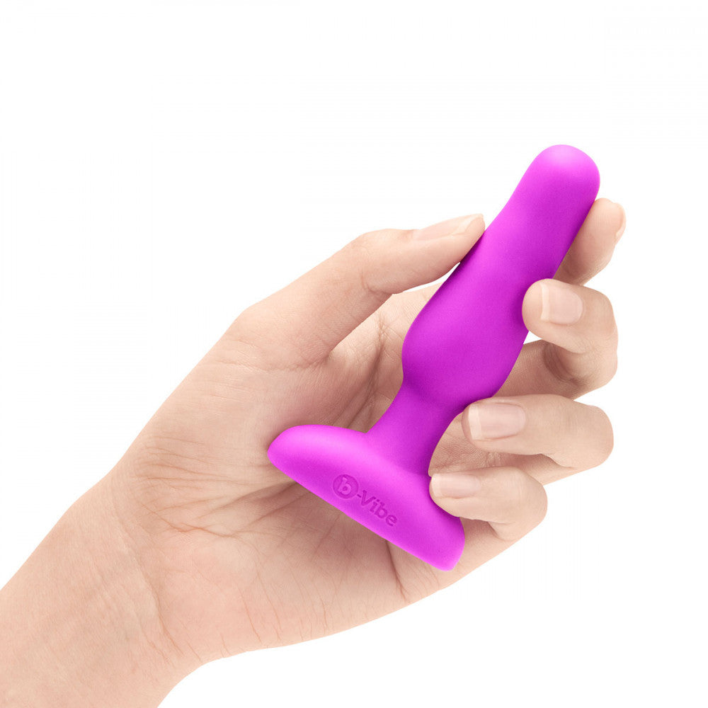 B-Vibe Novice Plug - Fuchsia on white background. Available at SugarX in Sex Toys in the Butt Plug collection.