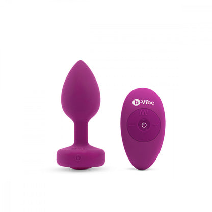 B-Vibe Vibrating Jewel Plug Small/Medium - Fuchsia on white background. Available at SugarX in Sex Toys in the Butt Plug collection.