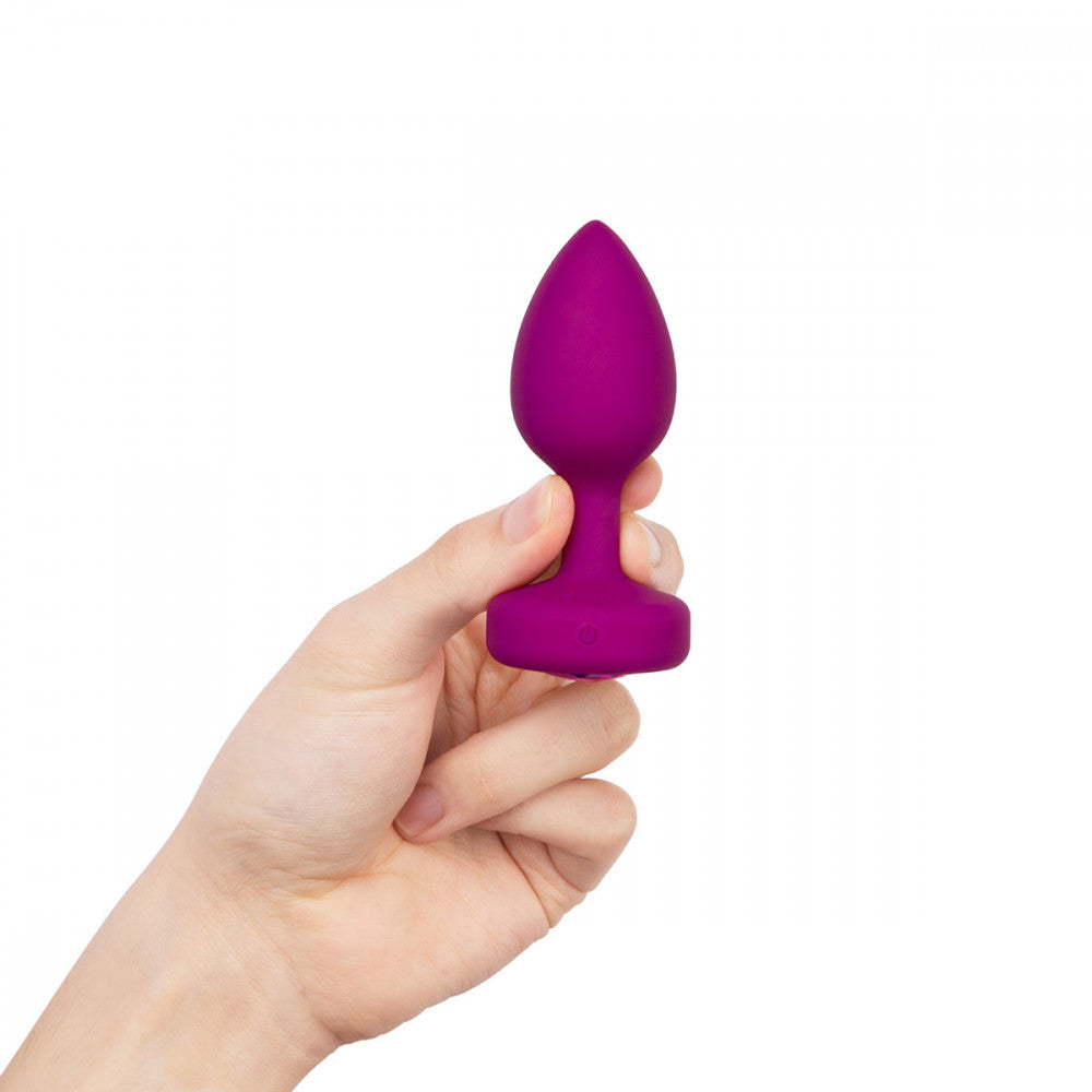 B-Vibe Vibrating Jewel Plug Small/Medium - Fuchsia on white background. Available at SugarX in Sex Toys in the Butt Plug collection.