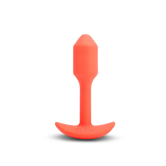 B-Vibe Vibrating Snug Plug 1 - Orange on white background. Available at SugarX in Sex Toys in the Butt Plug collection.