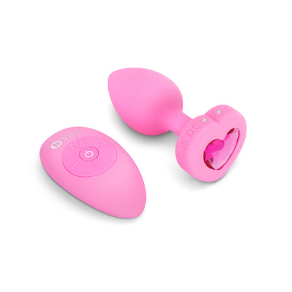 B-Vibe Vibrating Heart Plug Small/Medium - Pink Topaz on white background. Available at SugarX in Sex Toys in the Butt Plug collection.