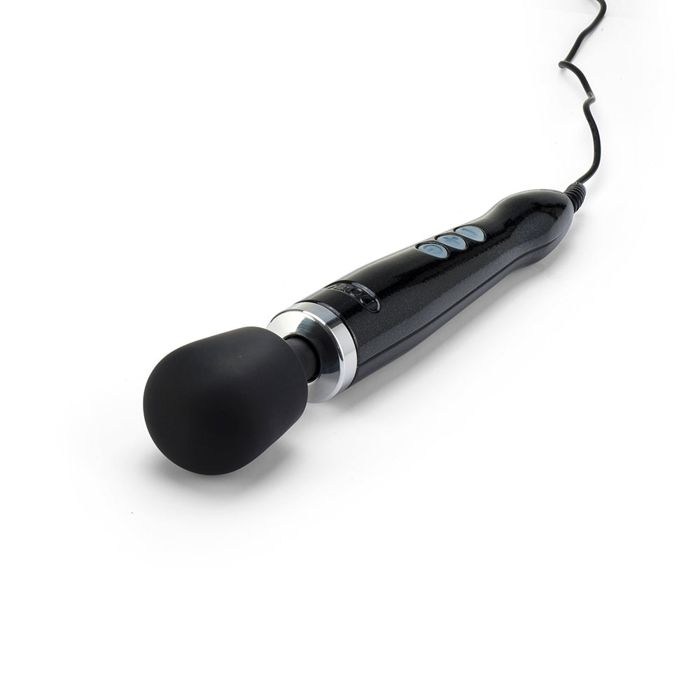 Doxy Die Cast Black wand vibrator lying flat on a plain white background, highlighting its smooth, powerful build. Available at SugarX in the Vibrators Collection. 