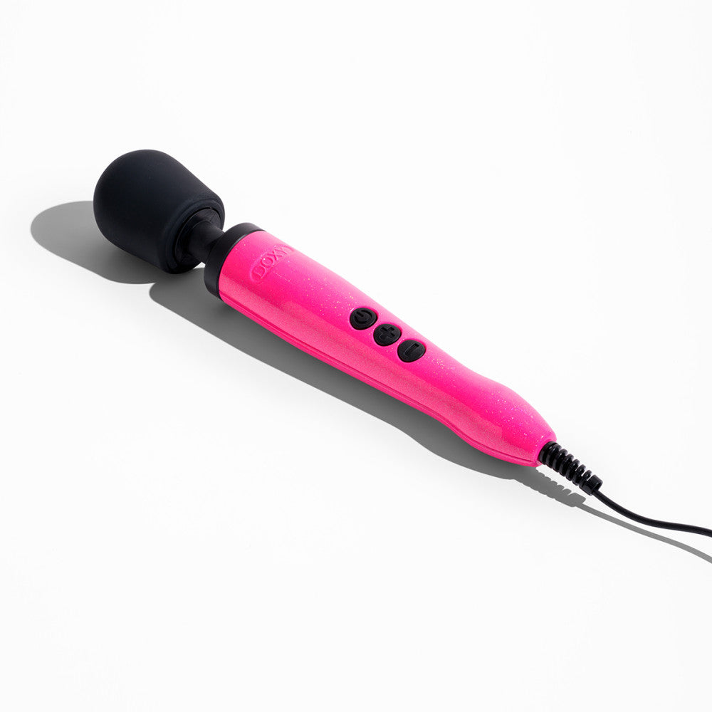 Doxy Die Cast Hot Pink wand vibrator lying flat on a white background. Premium sex toy for intense vibrations, available at SugarX in the Vibrators Collection.