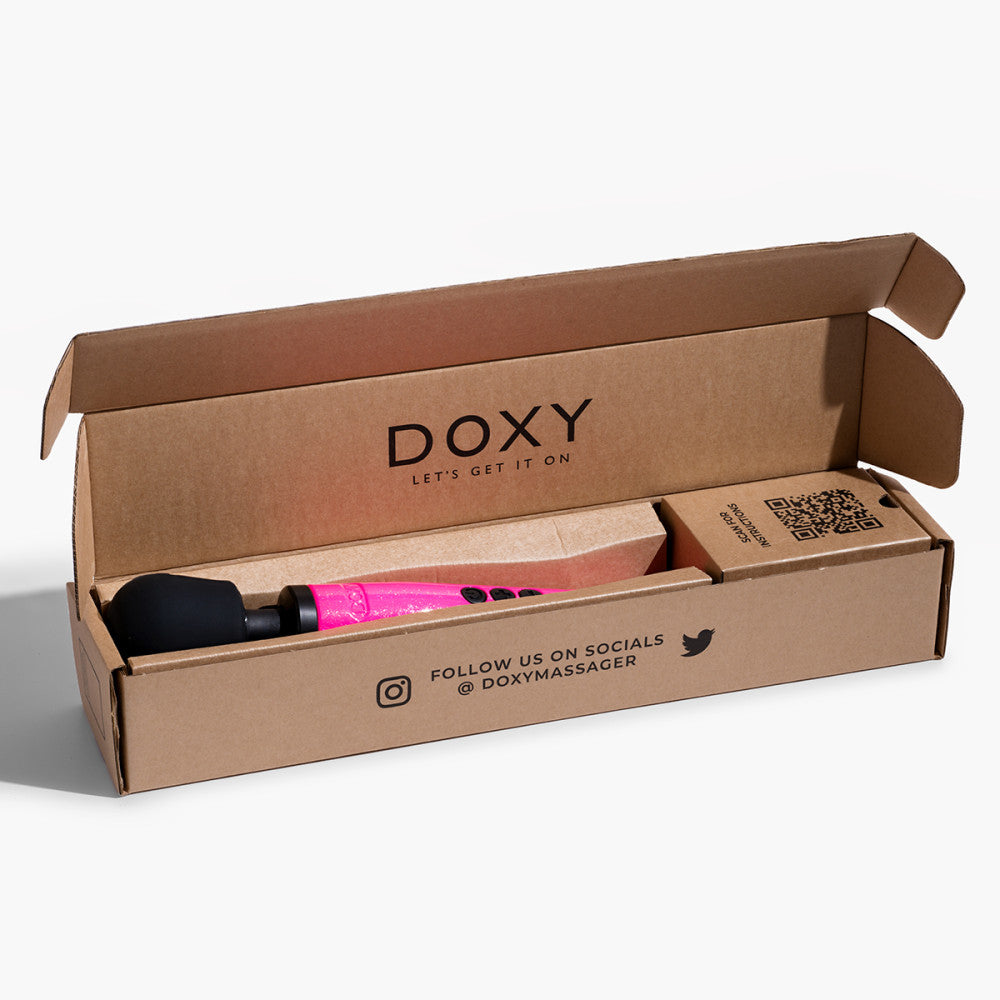 Doxy Die Cast Massager Hot Pink displayed inside its open box on a white background. Premium wand vibrator for powerful sensations, available at SugarX in the Vibrators Collection.