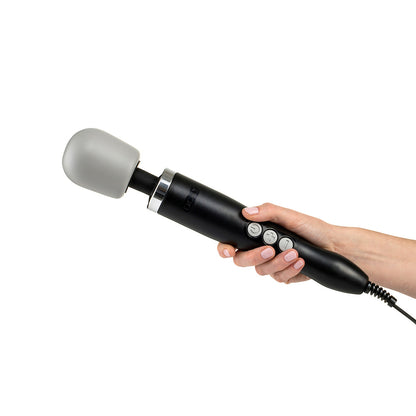 Doxy Original Massager wand vibrator being held by a hand on a plain white background. Available at SugarX in the Vibrators collection.