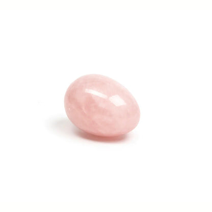 Rose quartz yoni egg by Chakrubs on neutral background at SugarX.