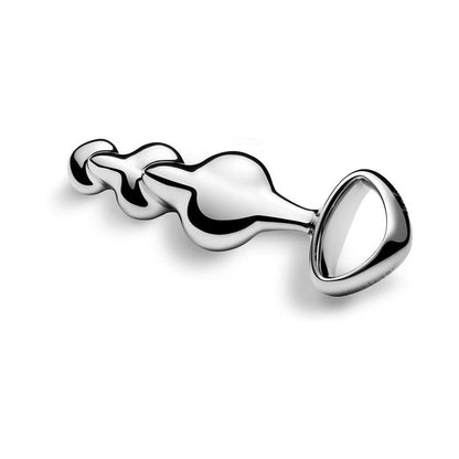 Njoy Disco metal butt plug positioned diagonally – heavy stainless steel anal plug from SugarX.