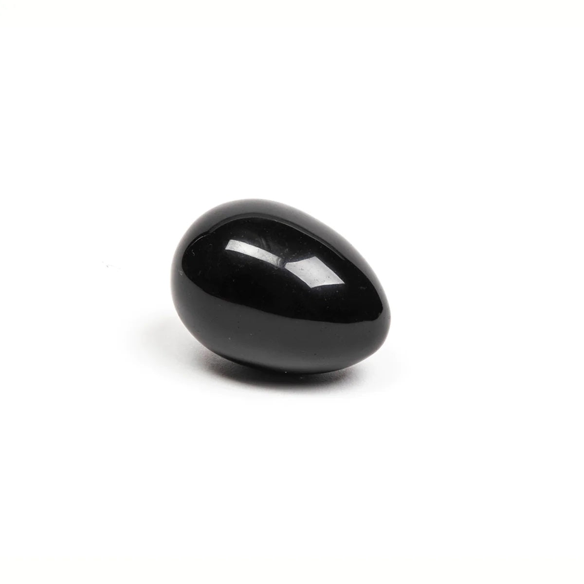 Xaga black obsidian yoni egg by Chakrubs at SugarX on white background