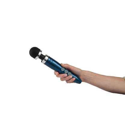 Blue flame Doxy Die Cast 3R wand vibrator being held in a hand against a plain white background. Ideal for intimate moments, available at SugarX in the Vibrators collection.