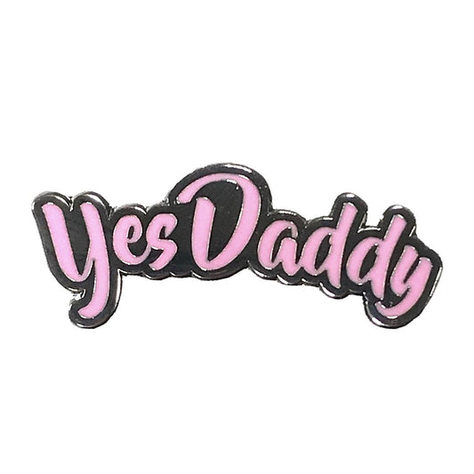 Geeky & Kinky Yes Daddy Pin displayed showcasing its design. Available at SugarX in Jewelry in the Pins collection.