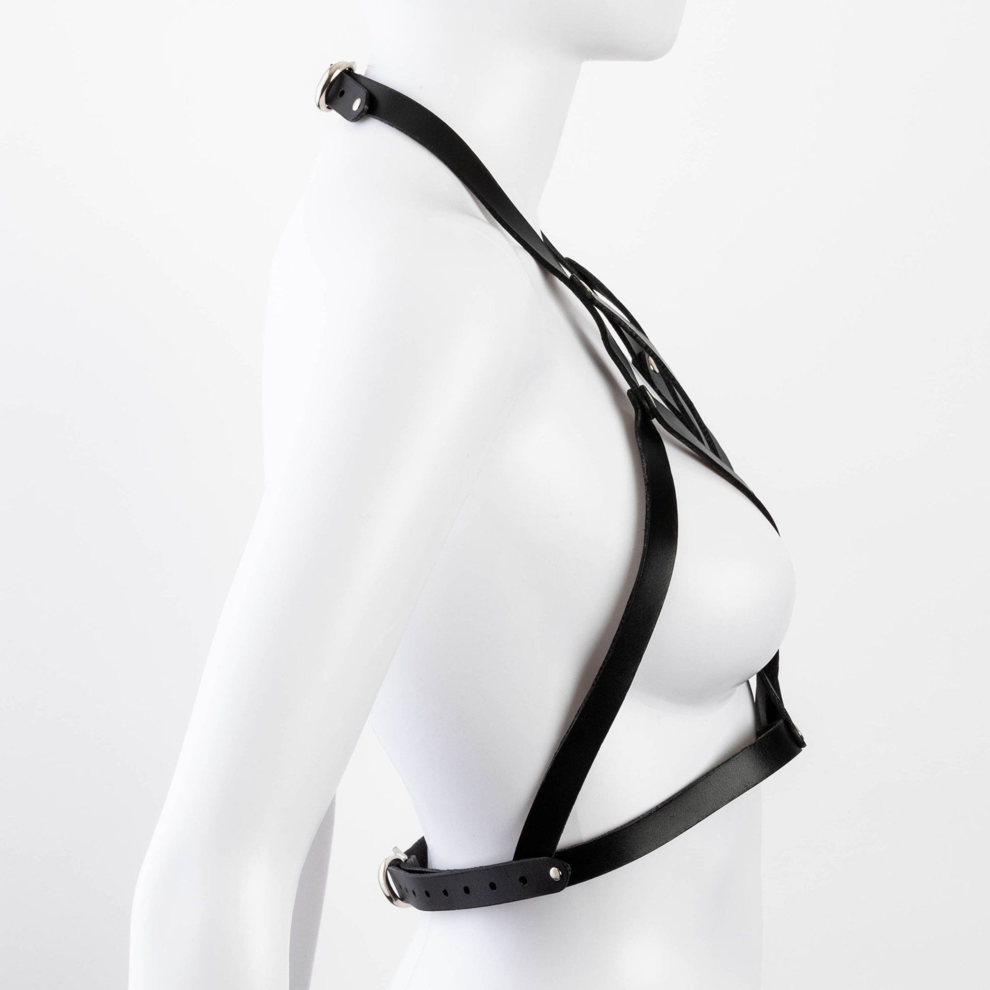 Side view of black Liberator Galway Harness on mannequin, showing off the adjustable straps and sleek black leather design at SugarX.