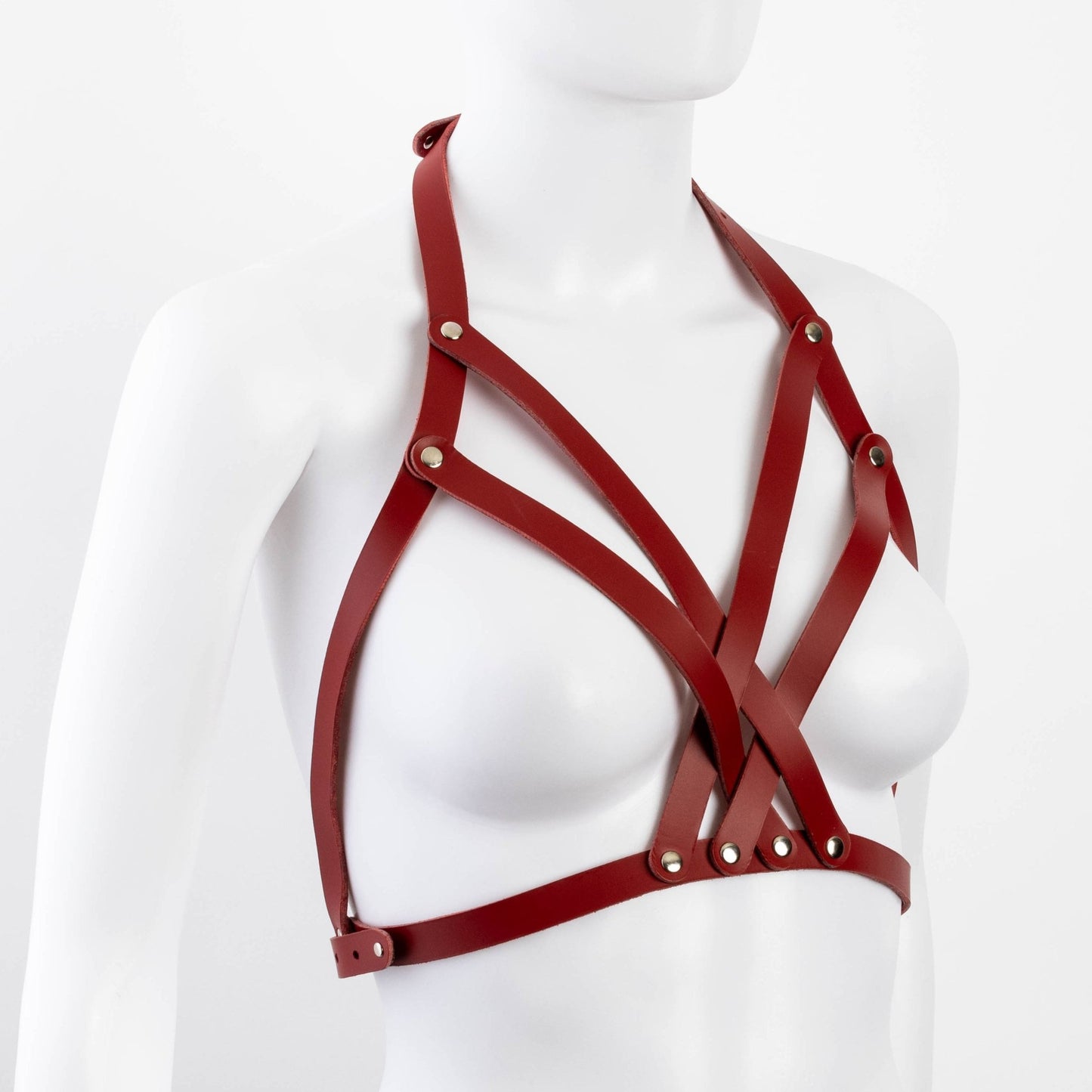 Diagonal angle of red Liberator Galway Harness on mannequin bust, showing off the chest strap matrix and overall craftsmanship at SugarX.