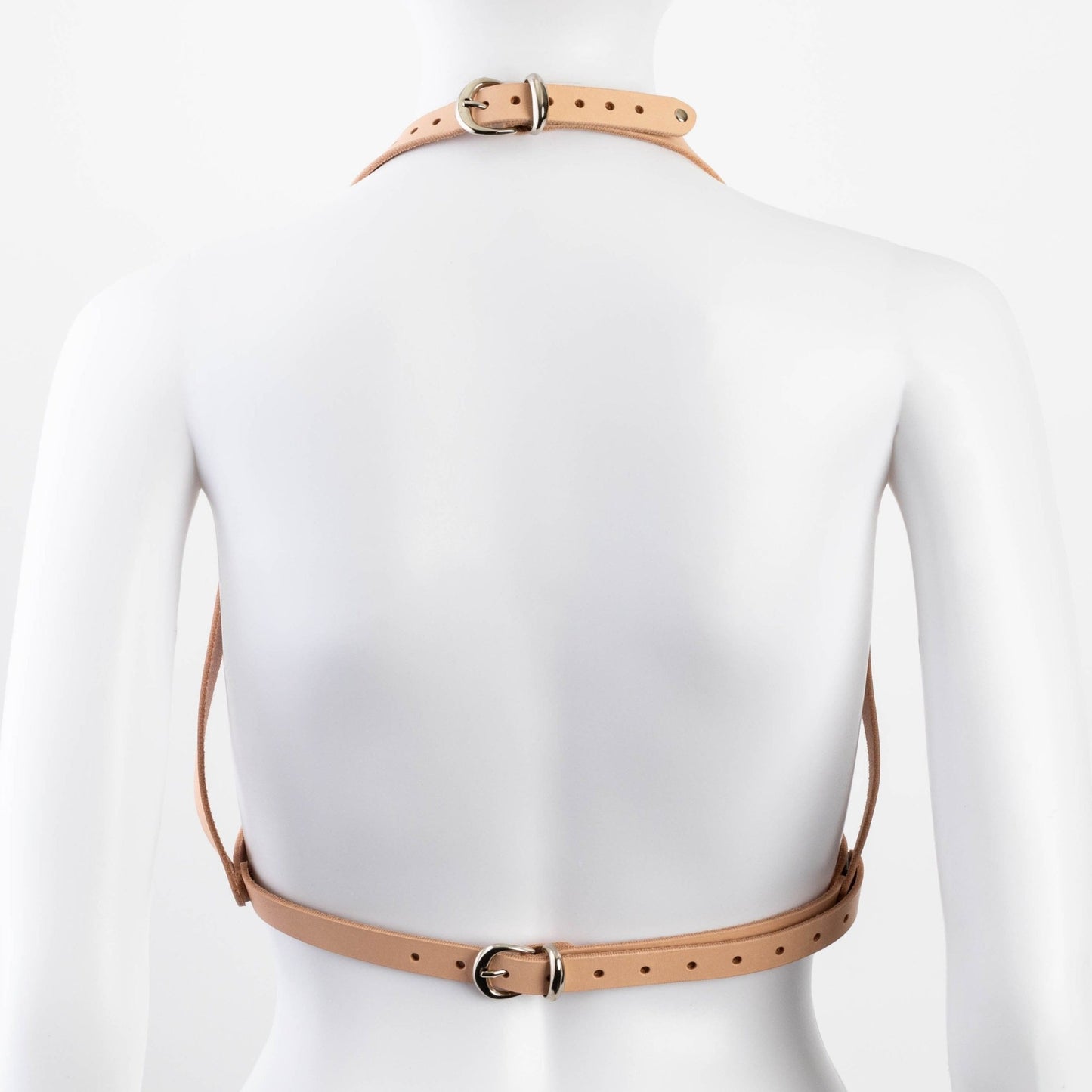 Back view of tan Liberator Galway Harness on mannequin, displaying the open-back design and reinforced rivets at SugarX.