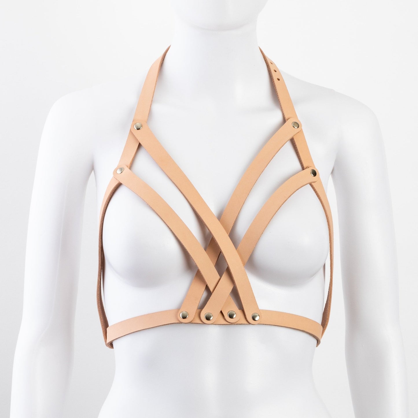 Tan leather Liberator Galway Harness on mannequin bust, front view, showcasing intricate leather straps and nickel-plated rivets at SugarX.