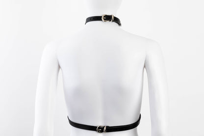 Liberator Lano Leather Chest Harness with adjustable straps, nickel-plated accents, and center O-ring for BDSM restraint and bondage play.  Shop now at SugarX! Black harness.