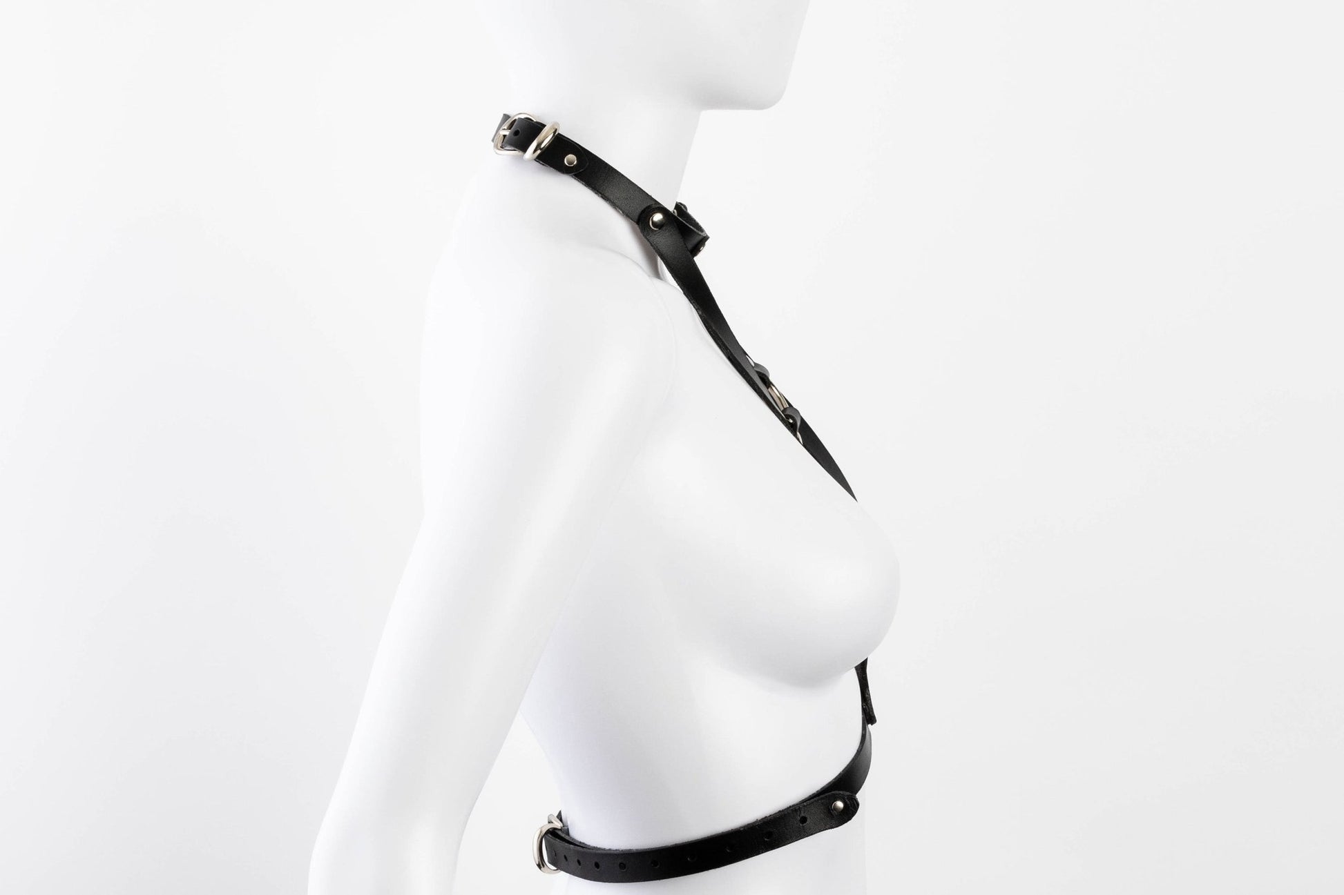 Liberator Lano Leather Chest Harness with adjustable straps, nickel-plated accents, and center O-ring for BDSM restraint and bondage play.  Shop now at SugarX! Black harness.