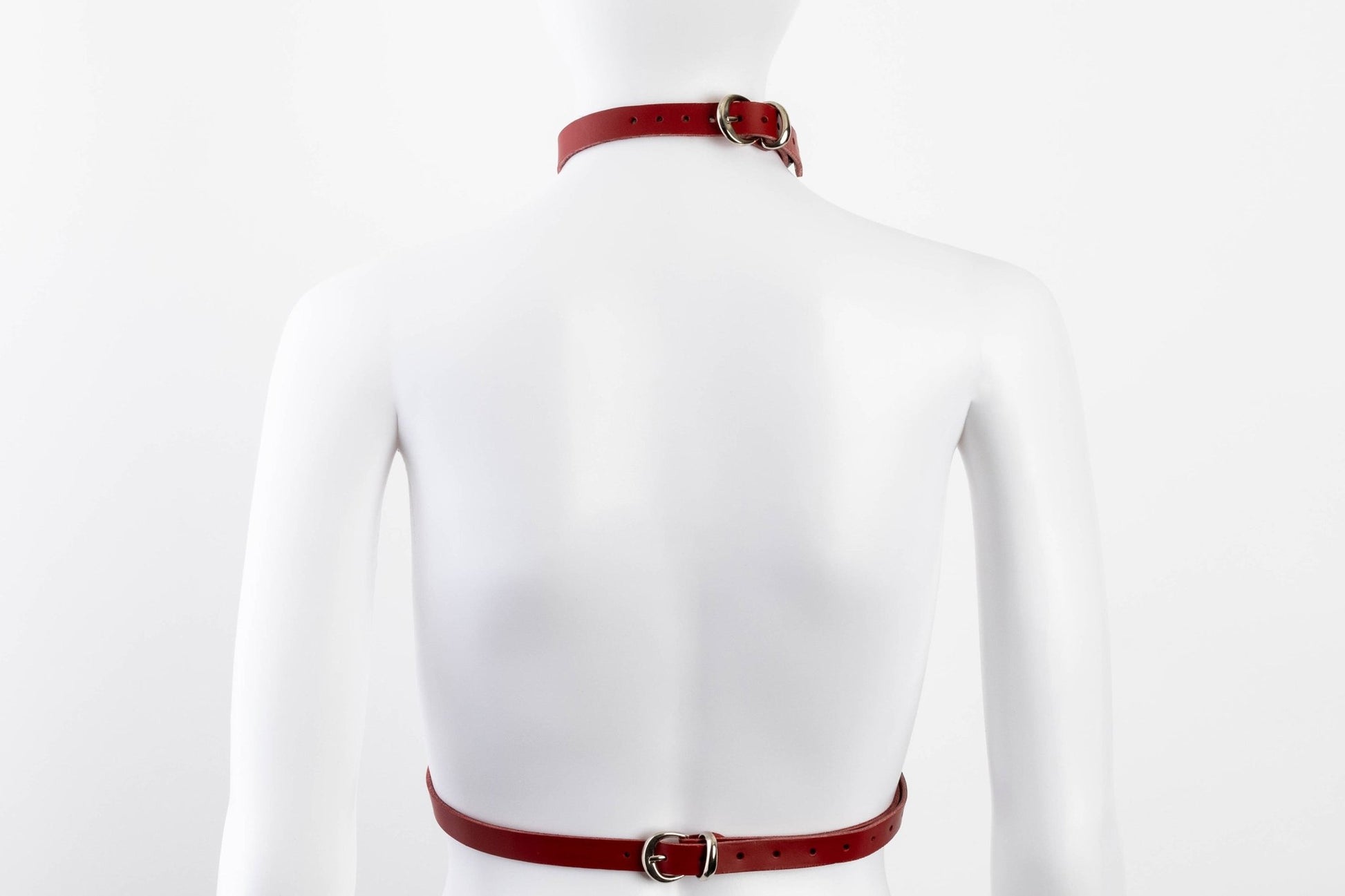 Liberator Lano Leather Chest Harness with adjustable straps, nickel-plated accents, and center O-ring for BDSM restraint and bondage play. Red, back view.