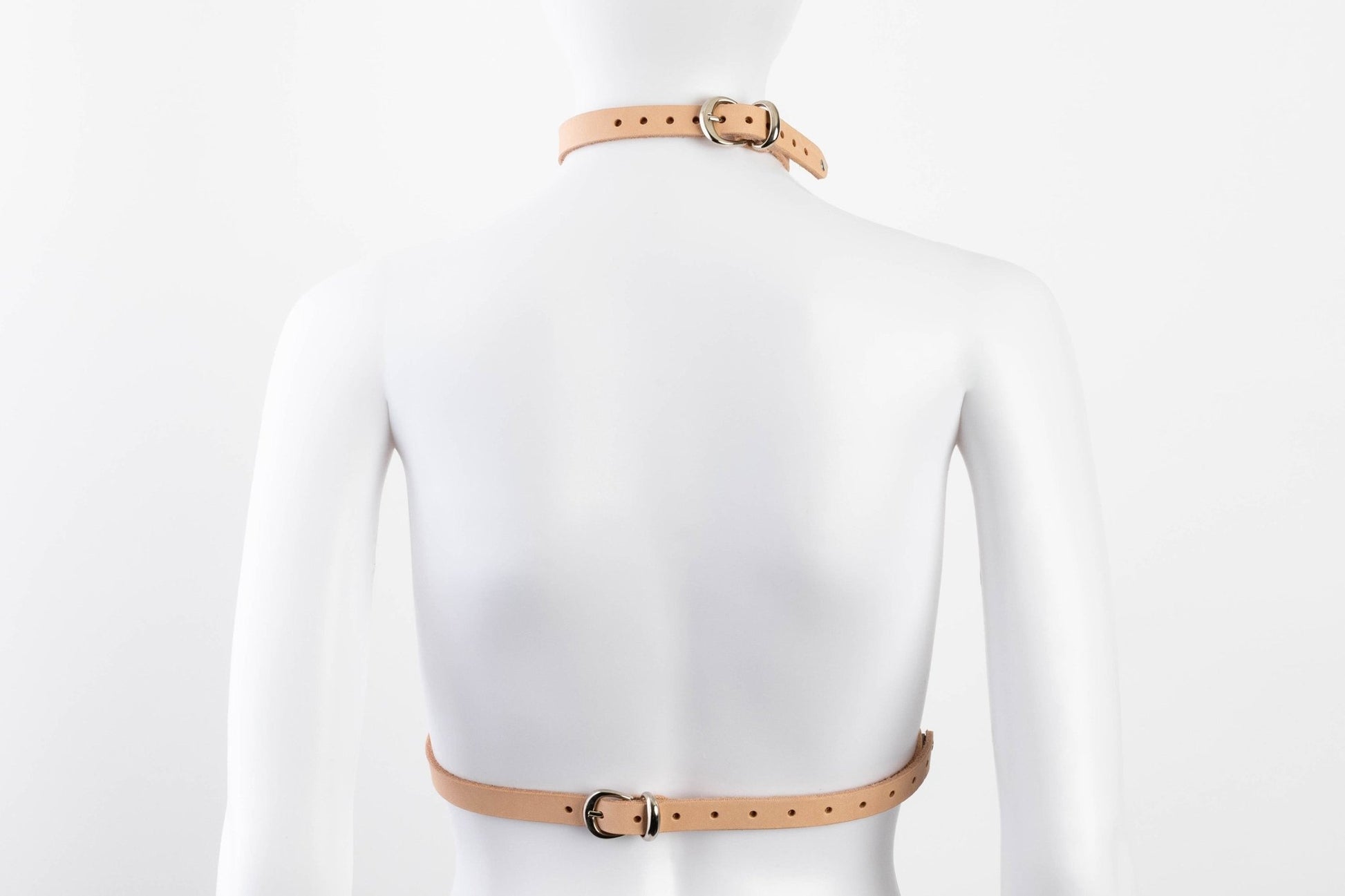 Liberator Lano Leather Chest Harness with adjustable straps, nickel-plated accents, and center O-ring for BDSM restraint and bondage play.  Shop now at SugarX! Tan harness, back view.