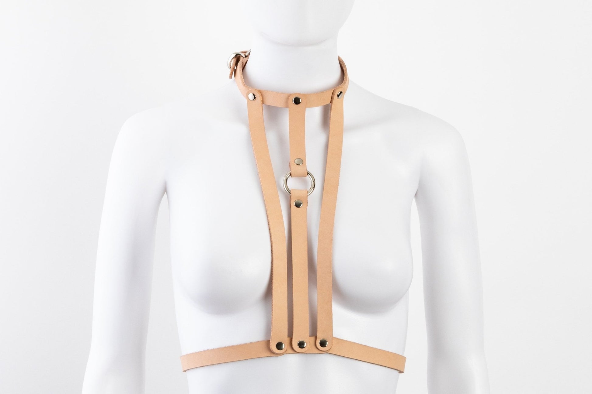 Liberator Lano Leather Chest Harness with adjustable straps, nickel-plated accents, and center O-ring for BDSM restraint and bondage play.  Shop now at SugarX! Tan harness, front view.